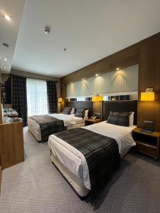Кровать или кровати в номере Grand Hotel Van