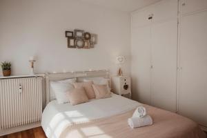 a bedroom with a bed with a towel on it at Studio cocoon hypercentre Carré d'or de Strasbourg in Strasbourg