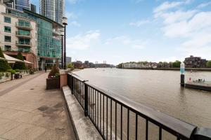 a view of a river in a city with buildings at The Lambeth Apartment in London