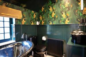 a bathroom with a sink and a toilet in it at Finest Retreats - Sisu Bakewell, Limestones Cottage in Bakewell +25 photos