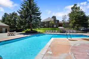 a swimming pool in a yard with a house at Hidden Creek by Park City Vacations in Park City