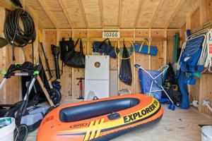 a room with a kayak and other equipment in it at Greystone Cottage in Union Pier
