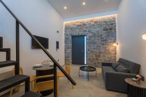 Posezení v ubytování EcoHeaven Suites