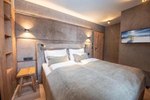 Ένα ή περισσότερα κρεβάτια σε δωμάτιο στο Filzsteinresort Wohnungen Top 4