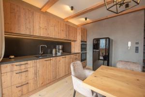 Kuchyň nebo kuchyňský kout v ubytování Filzsteinresort Wohnungen Top 7 + 6 fotografií