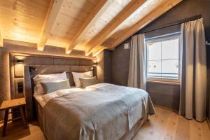 Ένα ή περισσότερα κρεβάτια σε δωμάτιο στο Filzsteinresort Wohnungen Top 12