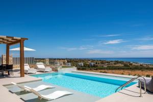 a swimming pool on the roof of a house at FYSIOPHYLIA VILLAS in Frangokastello