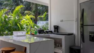 Kuchyň nebo kuchyňský kout v ubytování Playa Negra Home's CR + 32 fotografií
