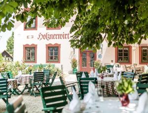 A restaurant or other place to eat at Salzburg Hotel Holznerwirt