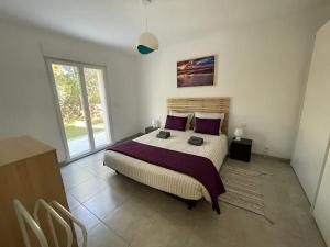 Łóżko lub łóżka w pokoju w obiekcie Villa Casa Sognu di Orizonte