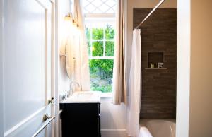 a bathroom with a sink and a window at Cleftstone Inn in Bar Harbor +111 photos