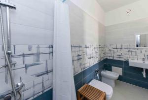 a bathroom with a toilet and a sink at Casa Vacanze - Costa Salentina in San Foca