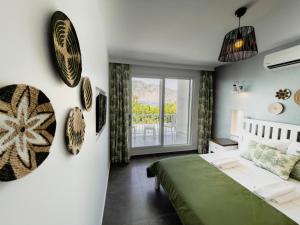 Кровать или кровати в номере Kıyı Hotel Selimiye