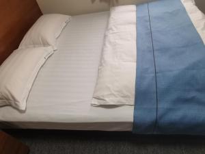 Postel nebo postele na pokoji v ubytování Business Hotel Azuma