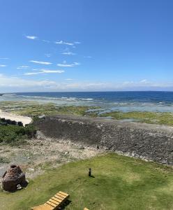 a view of the ocean and a stone wall at Ludao 38 Degree Ocean view B&B in Green Island