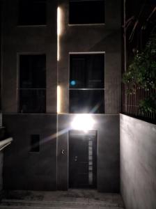 a building with a door with a light on it at Very beautiful new apartment in Yerevan
