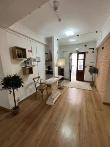 a living room with a table and a chair and a table at Casa da Moura in Moura