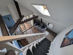 an overhead view of a living room and stairs with a window at Residenz Vier Jahreszeiten Monschau in Monschau