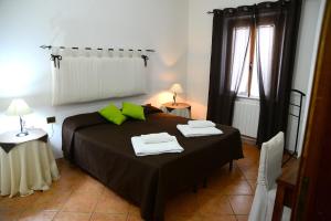 מיטה או מיטות בחדר ב-Agriturismo Sa Perda Marcada