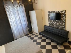 A bed or beds in a room at Manì Rooms