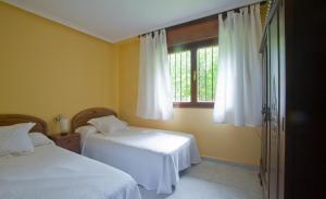 Ένα ή περισσότερα κρεβάτια σε δωμάτιο στο Casa Las Hortensias