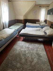 Postel nebo postele na pokoji v ubytování Horská Chata Gírová