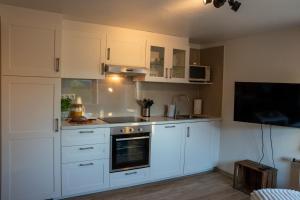 Kuchyň nebo kuchyňský kout v ubytování Feriemhof Kruse Wohnung Nr 1