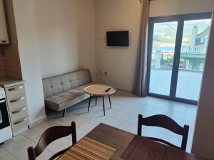 a living room with a couch and a table at Argostoli bay view in Argostoli