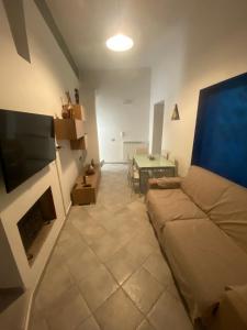 a living room with a couch and a table at Casa Vacanze Centro Storico in Centola
