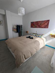 a bedroom with a large bed in a room at El rincón del Arbeyal in Gijón +13 photos