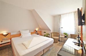 Postel nebo postele na pokoji v ubytování Top Hotel Krämer