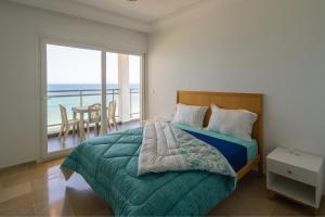 Postel nebo postele na pokoji v ubytování Novostar Apart Monte Carlo Sea View F71