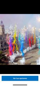 una imagen de una ciudad con humo de color en Apartamentos Bulevar en Valencia