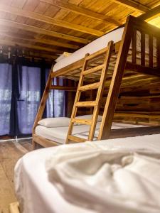 Postel nebo postele na pokoji v ubytování Hostal MOCAMBO BEACH