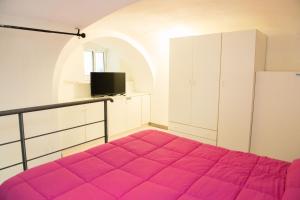 Ένα ή περισσότερα κρεβάτια σε δωμάτιο στο Casetta Mimma - Ischia Ponte