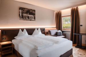 Monte Pana Dolomites Hotel客房内的一张或多张床位