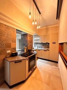 a kitchen with a stove and a stove top oven at Appartamento “Amelia” Sperlonga in Sperlonga +5 photos