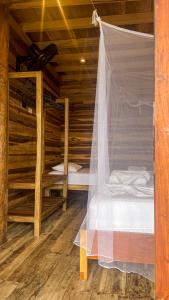Postel nebo postele na pokoji v ubytování Hostal MOCAMBO BEACH
