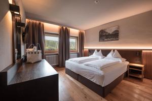 Monte Pana Dolomites Hotel客房内的一张或多张床位