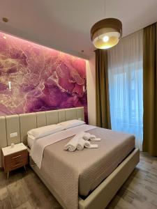 Postel nebo postele na pokoji v ubytování Le Dimore di Lorenzo