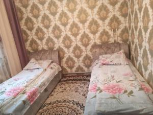 Postel nebo postele na pokoji v ubytování Нурислам