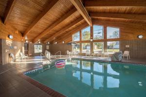 a large swimming pool in a house at River District Hotel in Prairie du Chien