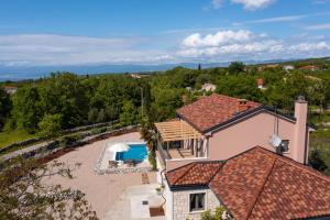 an aerial view of a house with a swimming pool at Villa Ulikva in Malinska