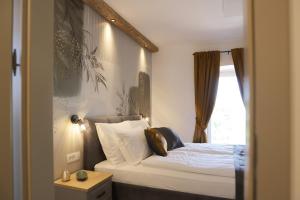 a bedroom with a bed and a window at Villa Ulikva in Malinska +32 photos
