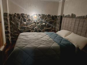 Postelja oz. postelje v sobi nastanitve intikilla hostal