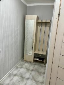 a bathroom with a sink and a mirror at Уютная квартира в 4 мкр Авангарда in Atyraū +2 photos