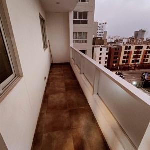 a balcony of a building with a view of a city at habitacion con camarote in Lima