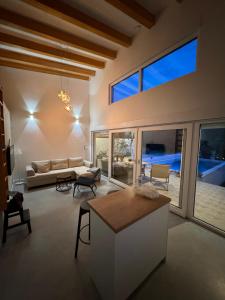 a living room with a couch and a table at House on the River in Blagaj