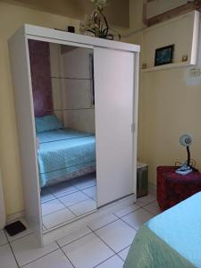 Ein Bett oder Betten in einem Zimmer der Unterkunft Meu Cantinho
