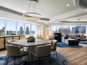 a living room with a table and chairs and a couch at The Westin San Diego Bayview in San Diego